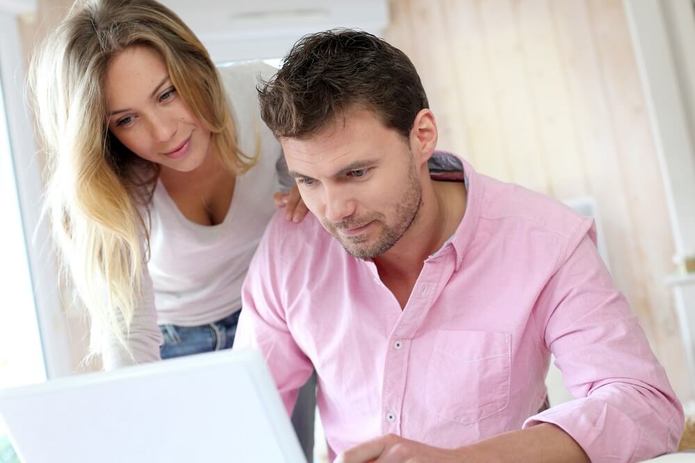 A couple looking at a laptop