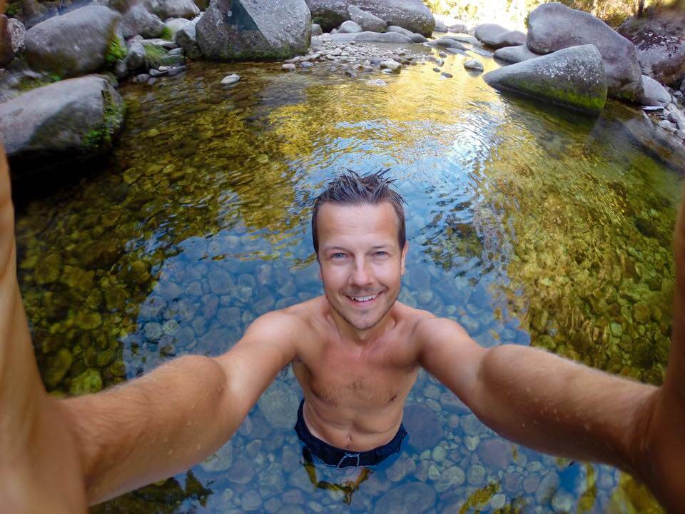 Man taking a selfie in shallow water
