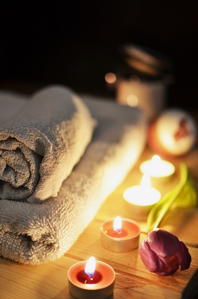 A spa towel and candles