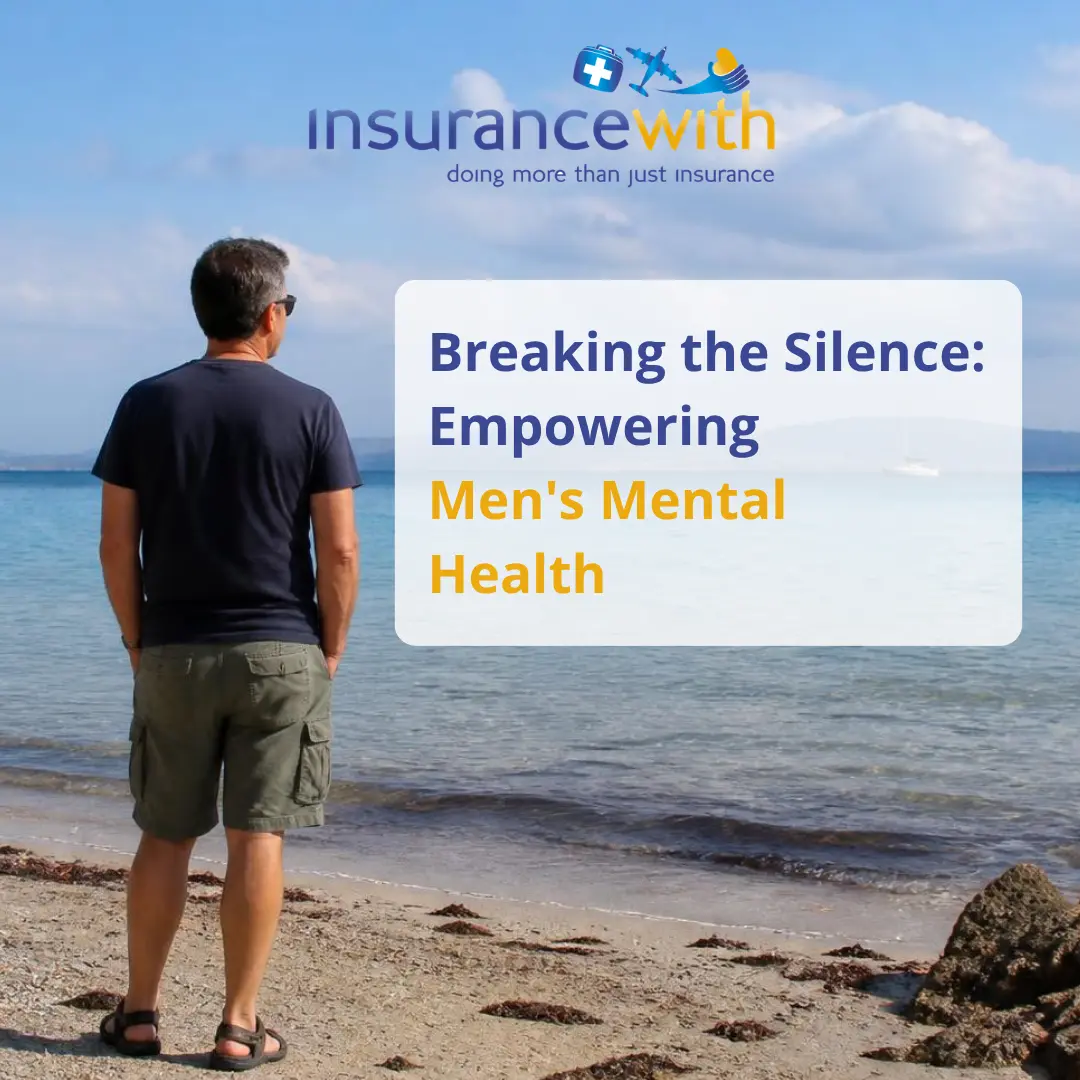 A man standing on a beach looking out at the sea.